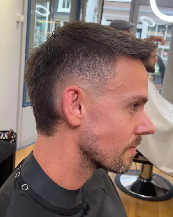 Short textured cut with a skin fade and beard