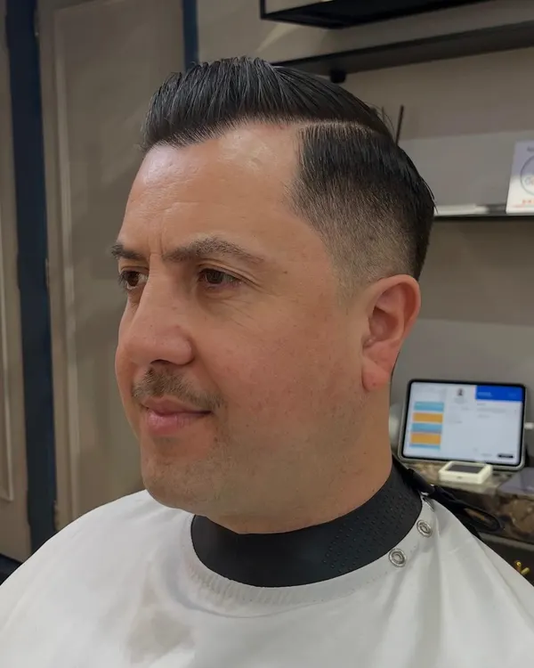 Classic side part with a tight taper