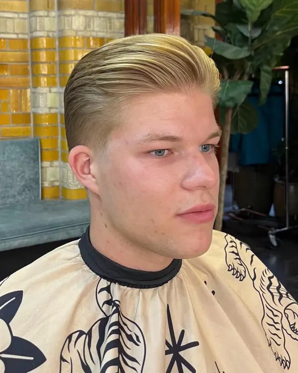 Blonde slick back with short sides