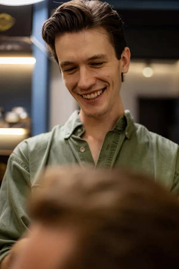 Ryan Kunkel smiling mid-cut